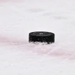 May 11, 2025; Dallas, Texas, USA; A view of an NHL puck with logo during the game between the Dallas Stars and the Winnipeg Jets in game three of the second round of the 2025 Stanley Cup Playoffs at American Airlines Center