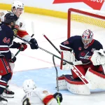 Jan 22, 2026; Winnipeg, Manitoba, CAN; Winnipeg Jets goaltender Connor Hellebuyck (37) makes a blocked stop on a Florida Panthers center Sam Bennett (9) shot in the third period at Canada Life Centre.