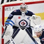 Apr 2, 2026; Dallas, Texas, USA; Winnipeg Jets goaltender Connor Hellebuyck (37) faces the Dallas Stars attack during the first period at the American Airlines Center. Mandatory Credit: Jerome Miron-Imagn Images