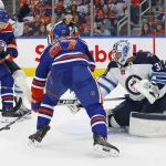 Oct 21, 2023; Edmonton, Alberta, CAN; Winnipeg Jets goaltender Connor Hellebuyck (37) makes a save on Edmonton Oilers forward Connor McDavid (97) during the first period at Rogers Place.