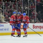 Mar 3, 2025; Montreal, Quebec, CAN; Montreal Canadiens forward Nick Suzuki (14) celebrates with teammates defenseman Arber Xhekaj (72) and defenseman Mike Matheson (8) after scoring a goal against the Buffalo Sabres during the first period at the Bell Centre.