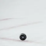 Nov 1, 2025; Columbus, Ohio, USA; The Columbus logo is seen on a game puck during the game between the St. Louis Blues and the Columbus Blue Jackets in the second period at Nationwide Arena. Mandatory Credit: Aaron Doster-Imagn Images