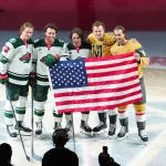 Mar 6, 2026; Las Vegas, Nevada, USA; Minnesota Wild left wing Matt Boldy (12), defenseman Brock Faber (7), defenseman Quinn Hughes (43), Vegas Golden Knights center Jack Eichel (9) and defenseman Noah Hanifin (15) are recognized for their accomplishments during the 2026 Winter Olympics before the start of a game at T-Mobile Arena.
