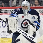 Oct 16, 2025; Philadelphia, Pennsylvania, USA; Winnipeg Jets goaltender Connor Hellebuyck (37) makes a save against the Philadelphia Flyers at Wells Fargo Center.