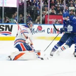 Mar 11, 2023; Toronto, Ontario, CAN; Toronto Maple Leafs center Calle Jarnkrok (19) battles for the puck in front of Edmonton Oilers goaltender Stuart Skinner (74) during the third period at Scotiabank Arena. Mandatory Credit: Nick Turchiaro-USA TODAY Sports