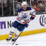 Apr 8, 2026; San Jose, California, USA; Edmonton Oilers defenseman Evan Bouchard (2) controls the puck against the San Jose Sharks during the second period at SAP Center at San Jose.