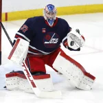 Mar 26, 2024; Winnipeg, Manitoba, CAN; Winnipeg Jets goaltender Connor Hellebuyck (37) warms up before a game against the Edmonton Oilers at Canada Life Centre.