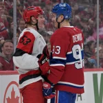 May 25, 2026; Montreal, Quebec, CAN; Carolina Hurricanes right wing Jackson Blake (53) and Montreal Canadiens right wing Ivan Demidov (93) react after a play during overtime in game three of the Eastern Conference Final of the 2026 Stanley Cup Playoffs at Bell Centre.