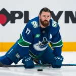 Apr 14, 2026; Vancouver, British Columbia, CAN; Vancouver Canucks defenseman Filip Hronek (17) stretches in warm up prior to a game against the Los Angeles Kings at Rogers Arena.