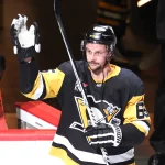 Mar 21, 2026; Pittsburgh, Pennsylvania, USA; Pittsburgh Penguins defenseman Erik Karlsson (65) reacts after being named first star of the game against the Winnipeg Jets at PPG Paints Arena.