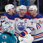 Apr 8, 2026; San Jose, California, USA; Edmonton Oilers center Connor McDavid (97) is congratulated by teammates after scoring against the San Jose Sharks during the first period at SAP Center at San Jose.