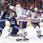 The Oilers top trade package for Connor Hellebuyck has emerged Mar 4, 2023; Winnipeg, Manitoba, CAN; Edmonton Oilers center Leon Draisaitl (29) celebrates his first period goal with Edmonton Oilers left wing Zach Hyman (18) on Winnipeg Jets goaltender Connor Hellebuyck (37) at Canada Life Centre. Mandatory Credit: James Carey Lauder-USA TODAY Sports