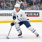 Mar 28, 2026; St. Louis, Missouri, USA; Toronto Maple Leafs center Max Domi (11) controls the puck against the St. Louis Blues during the first period at Enterprise Center.