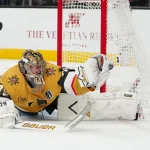 Jun 14, 2026; Las Vegas, Nevada, USA; Vegas Golden Knights goaltender Carter Hart (79) glove saves a shot by Carolina Hurricanes center Sebastian Aho (20) (not pictured) during the second period in game six of the 2026 Stanley Cup Final at T-Mobile Arena. Mandatory Credit: Stephen R. Sylvanie-Imagn Images