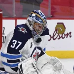Former RCMP assistant commissioner issues warning to NHL teams after Connor Hellebuyck trade request Mar 4, 2021; Montreal, Quebec, CAN; Winnipeg Jets goalie Connor Hellebuyck (37) gets hit in the mask by the puck during the second period of the game against the Montreal Canadiens at the Bell Centre. Mandatory Credit: Eric Bolte-USA TODAY Sports