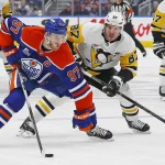 Jan 22, 2026; Edmonton, Alberta, CAN; Pittsburgh Penguins forward Sidney Crosby (87) chases Edmonton Oilers forward Connor McDavid (97) up the ice during the first period at Rogers Place.