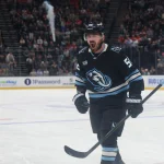 Mar 26, 2026; Salt Lake City, Utah, USA; Utah Mammoth defenseman MacKenzie Weegar (52) celebrates after scoring a goal against the Washington Capitals during the third period at Delta Center.