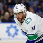 Jan 6, 2026; Buffalo, New York, USA; Vancouver Canucks left wing Evander Kane (91) waits for the face-off during the third period against the Buffalo Sabres at KeyBank Center.