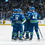 Mar 4, 2026; Vancouver, British Columbia, CAN; Vancouver Canucks defenseman Zeev Buium (24) and forward Nils Hoglander (21) and defenseman Filip Hronek (17) and forward Elias Pettersson (40) celebrate Hoglander's goal against the Carolina Hurricanes in the third period at Rogers Arena.