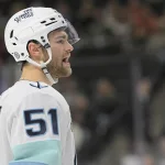 Mar 19, 2025; Saint Paul, Minnesota, USA; Seattle Kraken forward Shane Wright (51) yells to a teammate before a face-off against the Minnesota Wild during the third period at Xcel Energy Center
