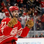 Dec 2, 2025; Detroit, Michigan, USA; Detroit Red Wings center Dylan Larkin (71) celebrates a goal by defenseman Ben Chiarot (not pictured) in the second period against the Boston Bruins at Little Caesars Arena.
