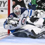 Feb 2, 2026; Dallas, Texas, USA; Winnipeg Jets goaltender Connor Hellebuyck (37) allows a goal to Dallas Stars defenseman Nils Lundkvist (not pictured) during the second period at the American Airlines Center.