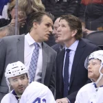 Mar 11, 2019; Toronto, Ontario, CAN; Toronto Maple Leafs assistant coach Jim Hiller talks to head coach Mike Babcock on the bench in the third period against the Tampa Bay Lightning at Scotiabank Arena. The Lightning beat the Maple Leafs 6-2.