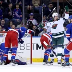 Nov 9, 2023; New York, New York, USA; Minnesota Wild right wing Brandon Duhaime (21) celebrates his goal against New York Rangers goaltender Louis Domingue (70) during the second period at Madison Square Garden.