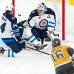 Apr 13, 2026; Las Vegas, Nevada, USA; Vegas Golden Knights right wing Pavel Dorofeyev (16) scores a goal against Winnipeg Jets goaltender Connor Hellebuyck (37) during the third period at T-Mobile Arena.