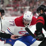 May 29, 2026; Raleigh, North Carolina, USA; Montreal Canadiens center Kirby Dach (77) prepares for a faceoff against Carolina Hurricanes left wing Mark Jankowski (77) in game five of the Eastern Conference Final of the 2026 Stanley Cup Playoffs during the second period at Lenovo Center.