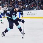 Feb 28, 2026; Seattle, Washington, USA; Seattle Kraken center Shane Wright (51) takes a shot on goal during the second period against the Vancouver Canucks at Climate Pledge Arena.