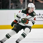 Apr 9, 2026; Dallas, Texas, USA; Minnesota Wild defenseman Quinn Hughes (43) skates against the Dallas Stars during the game between the Stars and the Wild at American Airlines Center.
