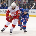 Apr 4, 2026; New York, New York, USA; Detroit Red Wings left wing James van Riemsdyk (21) tries to get past New York Rangers right wing Gabe Perreault (94) during the third period at Madison Square Garden.