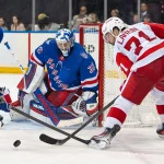 Apr 4, 2026; New York, New York, USA; Detroit Red Wings center Dylan Larkin (71) takes a shot at New York Rangers goalie Jonathan Quick (32) during the third period at Madison Square Garden.