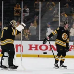 May 1, 2026; Boston, Massachusetts, USA; Boston Bruins center Morgan Geekie (39), goaltender Jeremy Swayman (1), center Fraser Minten (93) and center Alex Steeves (21) head for the locker room after their 4-1 loss to the Buffalo Sabres in game six of the first round of the 2026 Stanley Cup Playoffs at TD Garden.
