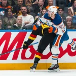 Jan 17, 2026; Vancouver, British Columbia, CAN; Vancouver Canucks forward Elias Pettersson (40) checks Edmonton Oilers forward Connor McDavid (97) in the first period at Rogers Arena.