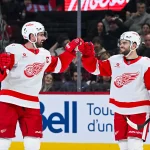 Jan 10, 2026; Montreal, Quebec, CAN; Detroit Red Wings center Dylan Larkin (71) celebrates with right wing Alex DeBrincat (93) his goal against the Montreal Canadiens during the second period at Bell Centre.