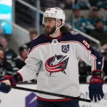 Jan 6, 2026; San Jose, California, USA; Columbus Blue Jackets right winger Kirill Marchenko (86) waits for play to resume against the San Jose Sharks in the first period at SAP Center at San Jose.