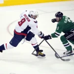 fends against Washington Capitals left wing Alex Ovechkin (8) during the third period at the American Airlines Center. The Stars defeat the Capitals 4-3.