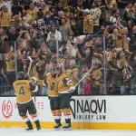 Jun 9, 2026; Las Vegas, Nevada, USA; Vegas Golden Knights center Brett Howden (21) celebrates with center Colton Sissons (10) and defenseman Rasmus Andersson (4) after a goal during the 2nd period against the Carolina Hurricanes in game four of the 2026 Stanley Cup Final at T-Mobile Arena