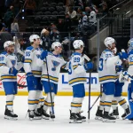 Apr 16, 2026; Salt Lake City, Utah, USA; The St. Louis Blues celebrate after defeating the Utah Mammoth at Delta Center.