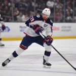 Dec 22, 2025; Los Angeles, California, USA; Columbus Blue Jackets center Adam Fantilli (19) controls the puck against the Los Angeles Kings during the first period at Crypto.com Arena.