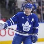 Mar 12, 2026; Toronto, Ontario, CAN; Toronto Maple Leafs forward John Tavares (91) reacts toward goaltender Joseph Woll (60) after scoring against the Anaheim Ducks during the second period at Scotiabank Arena.