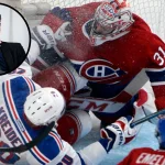17 mai 2014 ; Montréal, Québec, Canada ; l'attaquant des Rangers de New York Chris Kreider (20) entre en collision avec le gardien de but des Canadiens de Montréal Carey Price (31) au cours de la deuxième période du premier match de la finale de l'Association de l'Est des séries éliminatoires de la Coupe Stanley 2014, au Centre Bell.