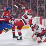 May 25, 2026; Montreal, Quebec, CAN; Montreal Canadiens right wing Zachary Bolduc (76) and Carolina Hurricanes defenseman Sean Walker (26) battle during the first period in game three of the Eastern Conference Final of the 2026 Stanley Cup Playoffs at Bell Centre.