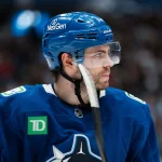 Apr 14, 2026; Vancouver, British Columbia, CAN; Vancouver Canucks forward Jake DeBrusk (74) during a stop in play against the Los Angeles Kings in the second period at Rogers Arena.