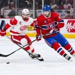 Dec 2, 2023; Montreal, Quebec, CAN; Montreal Canadiens right wing Joel Armia (40) plays the puck against Detroit Red Wings center Dylan Larkin (71) during the first period at Bell Centre.