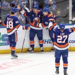 Mar 26, 2026; Elmont, New York, USA; New York Islanders center Bo Horvat (14) celebrates with his teammates after scoring a goal in the first period against the Dallas Stars at UBS Arena.