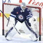 Mar 5, 2024; Winnipeg, Manitoba, CAN; Winnipeg Jets goaltender Connor Hellebuyck (37) warms up before a game against the Seattle Kraken at Canada Life Centre.