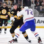 Dec 23, 2025; Boston, Massachusetts, USA; Boston Bruins defenseman Nikita Zadorov (91) fights with Montreal Canadians defenseman Arber Xhekaj (72) during the first period at TD Garden.